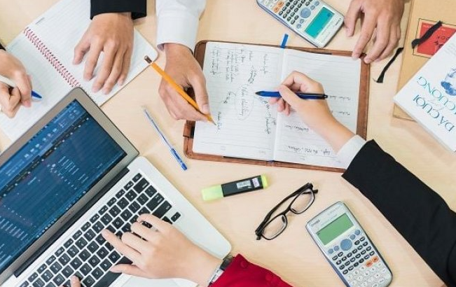 A group of people working on a project

AI-generated content may be incorrect.