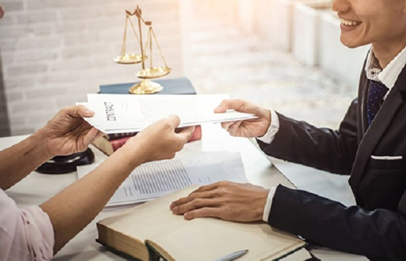 A person handing over a book to another person

AI-generated content may be incorrect.